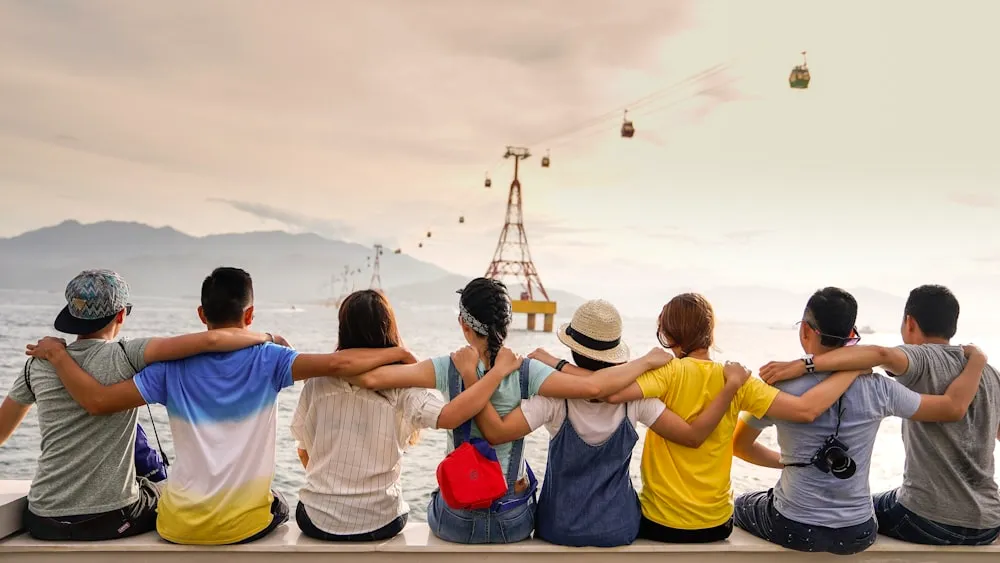 Group of people sitting together outdoors